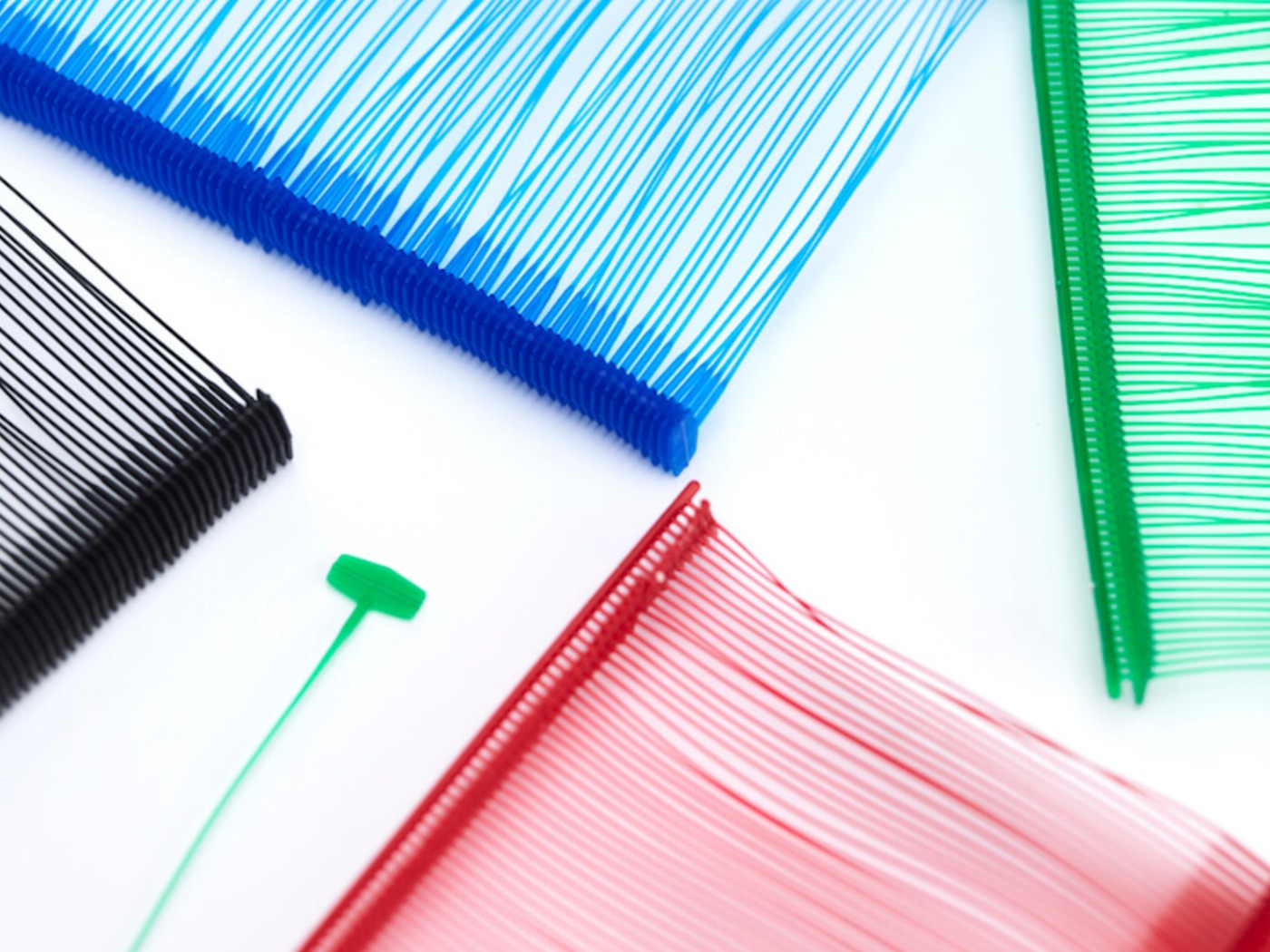 Colour range of Tag Pins — black, blue, green and red