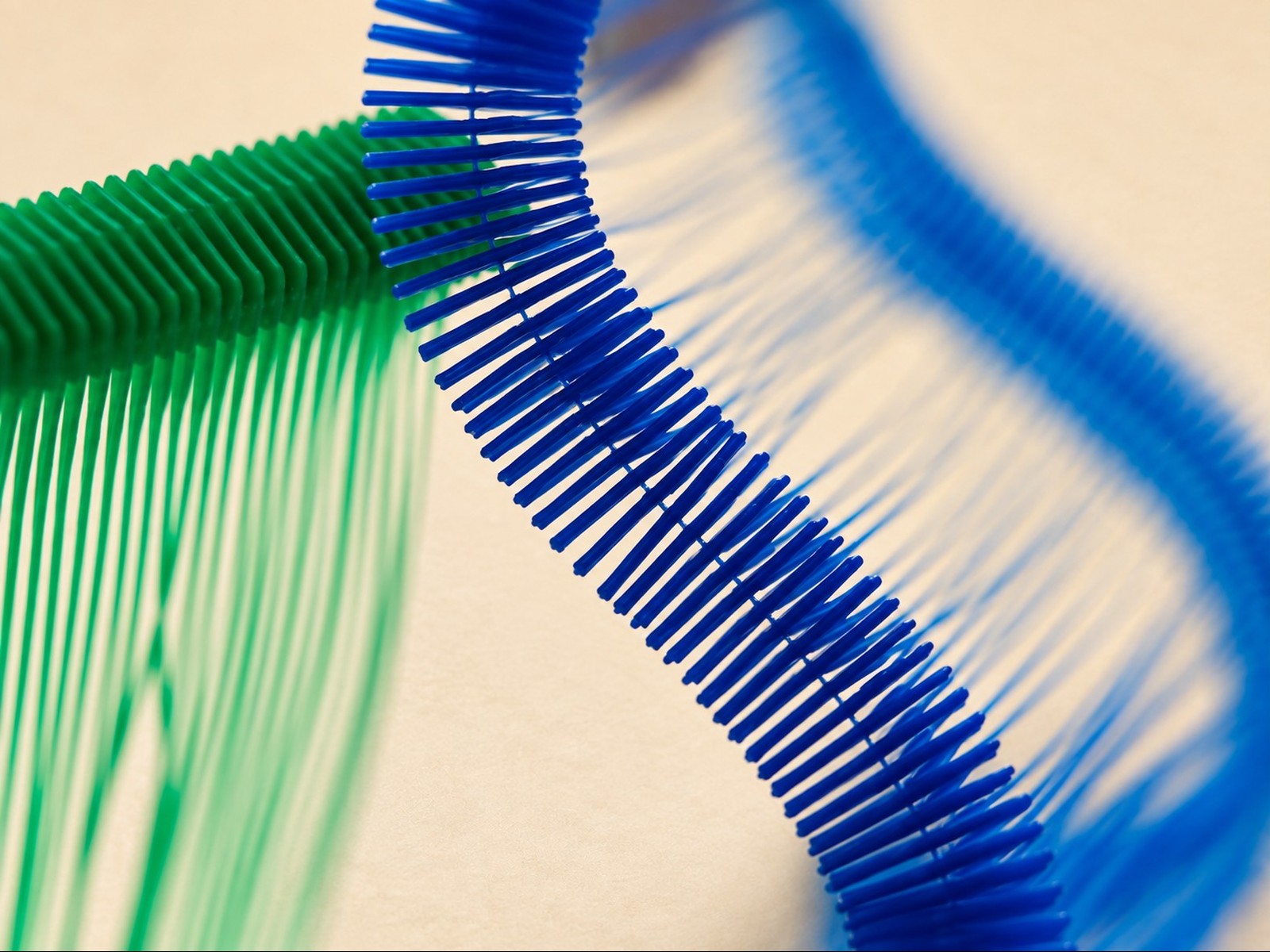 Blue and green Tag Pins, close-up